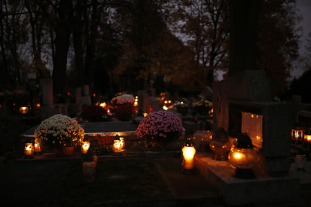 burning candles at the cemetery on All Saints' Dayの写真素材