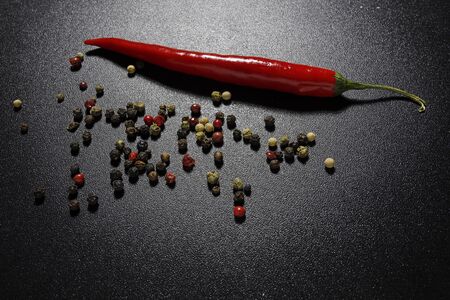 red chili pepper on black backgroundの写真素材