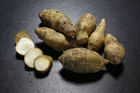 Jerusalem artichoke (Jerusalem artichoke) on black backgroundの写真素材