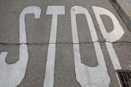 stop sign painted on the road