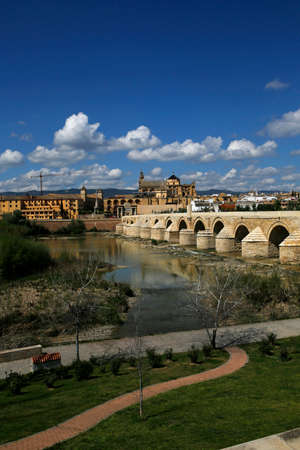 view of the Roman Bridge and Mosque-Cathedral on the Guadalquivir River, Cordoba, Spainの写真素材