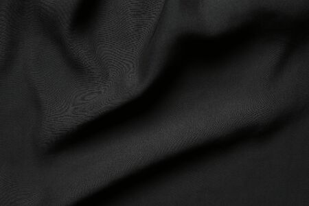 Black elegant wavy fabric backgroundの写真素材