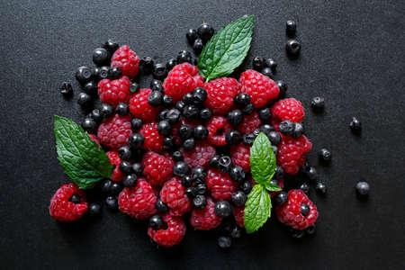 Fresh summer fruits on black backgroundの写真素材