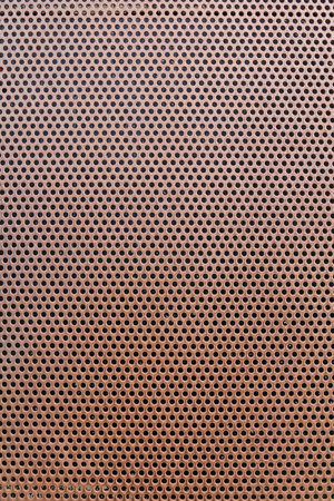 old metal background with holesの写真素材