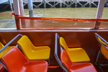 closeup of colorful chairs on a river boat in Bangkokの写真素材