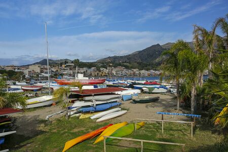 colorful fishing boats in Giardini-Naxos touristic resort on Sicili, Italyの写真素材