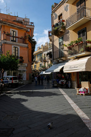 Taormina, Sicily, Italy - november 13, 2019: one of the narrow, picturesque street on the old town in Taormina. Taormina is one of the most beautiful and popular towns in Sicily.のeditorial素材