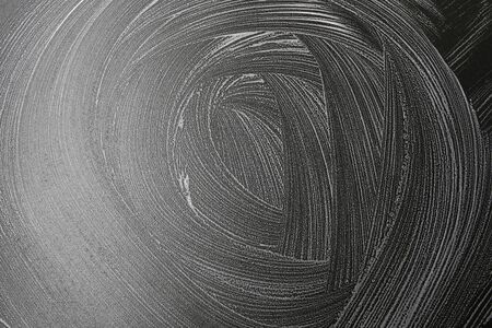 soap foam stains on a black shiny background