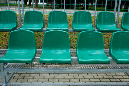 empty green stadium seatsの写真素材