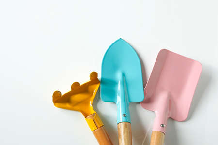 composition of cute colorful gardening tools on white shiny backgroundの写真素材