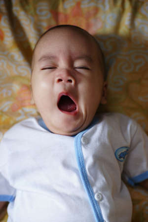 A asian chinese 4 months old baby boy taken by a standard lens.の写真素材