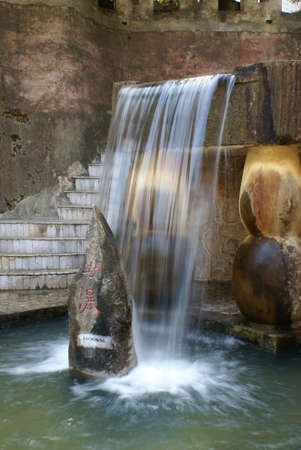 A small waterfall in a park of China. Taken with a slow shuter speed         の写真素材