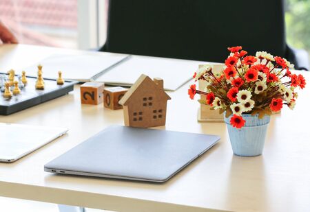 Close-Up Of Model Home On Wooden Table for Real Estate and loan conceptの写真素材