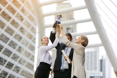 Business Teamwork concept., Business people get a trophy and  celebrate in Achieving success.