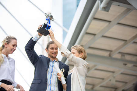 Business Teamwork concept., Business people get a trophy and  celebrate in Achieving success.の写真素材