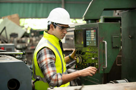 Factory Engineer Operating Hydraulic Tube or cnc machine in factory