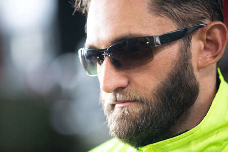 Portrait of male Engineer standing with confident against machine environment in factory