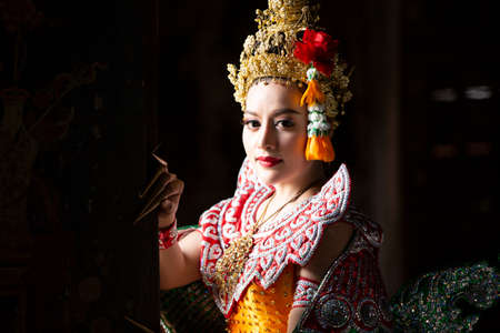 Beautiful Thai young woman portrait in Kinnaree traditional dress costume Art culture Thailand...