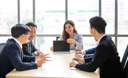 Business women doing presentation on laptop, Multiethnic diverse group of business coworkers in team...