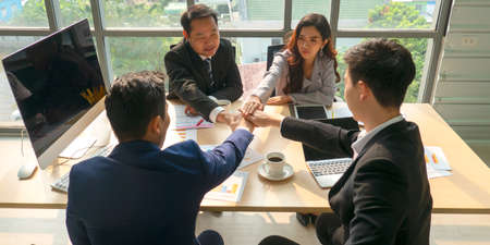 young business people putting their hands together. Stack of hands. Unity, teamwork conceptの写真素材