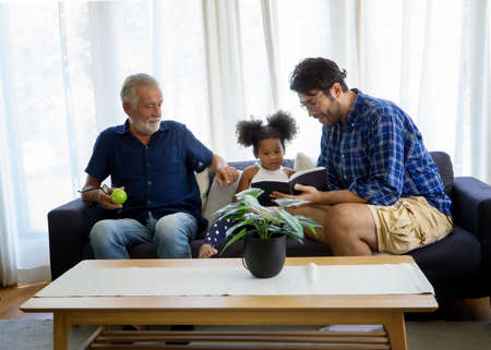 Happy multi-generation family, Happy parents enjoy time with their children at homeの写真素材