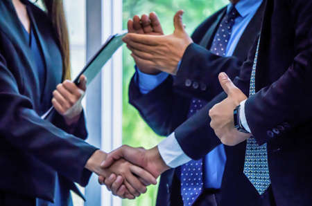Diverse business people group put hands together in stack pile at training as concept of. Business...