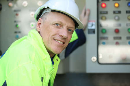 Engineer working on checking and maintenance equipment at solar panels power farm, photovoltaic cell...
