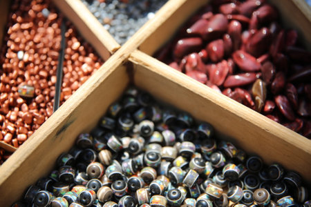 Close up of different types of beans in a wooden box for saleの写真素材