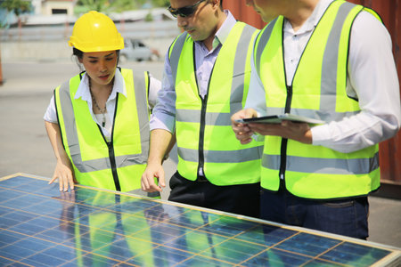 technicians install panels Solar cells to produce and distribute electricity. Energy technology...