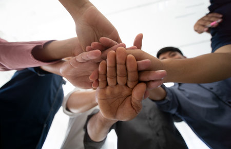 Group of business people joining hands together in circle, Teamwork conceptの写真素材