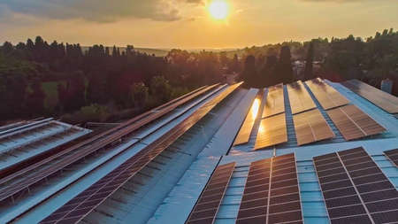 Eco technology for electric power., Aerial view of solar panels or solar cells on the roof in farm. Power plant with green field, renewable energy source in Thailand.の写真素材