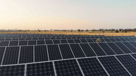 Eco technology for electric power., Aerial view of solar panels or solar cells on the roof in farm....