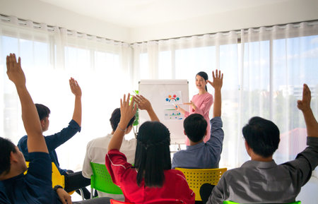 A group of business people are meeting to analyze data for marketing plan
