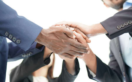 Business people join hands together to support each other. Teamwork conceptの写真素材