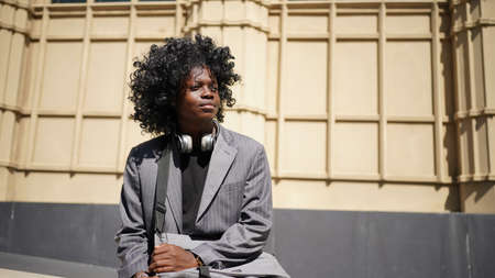 Portrait of young attractive stylish african american man model posing in casual clothes against...