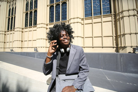 Portrait of young attractive stylish african american man model posing in casual clothes against neutral background looking sexy with afro hair. In People Youth Beauty and fashion concept.の写真素材