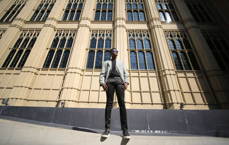 Portrait of young attractive stylish african american man model posing in casual clothes against neutral background looking sexy with afro hair. In People Youth Beauty and fashion concept.の写真素材