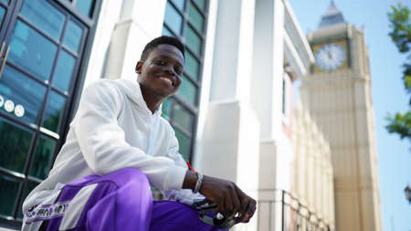 Portrait of young attractive stylish african american man model posing in casual clothes against...