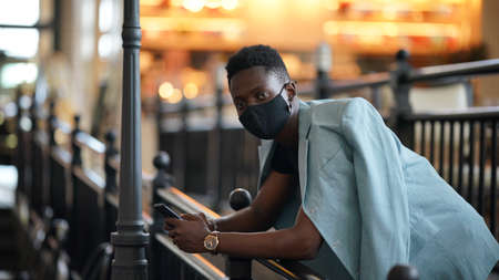 Portrait of young attractive stylish african american man model posing in casual clothes against...