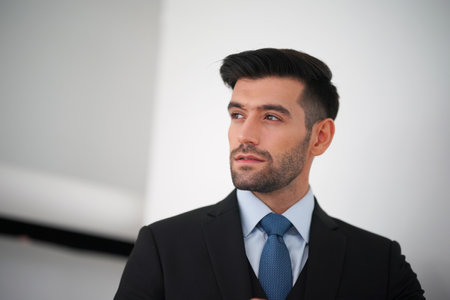 Elegant young Caucasian handsome man on White background, Studio fashion portrait.の写真素材