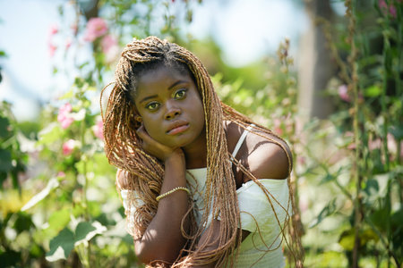 Young Attractive Black Skin Woman, Afro Hairstyle, In nature Backgroundの写真素材
