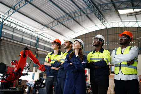 engineer checking control panel and teaching new Automatics robot arm and operating control machine...