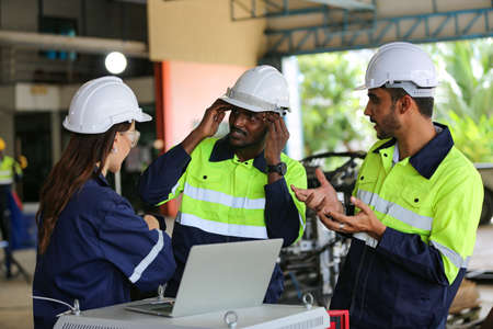 engineer checking control panel and teaching new Automatics robot arm and operating control machine...