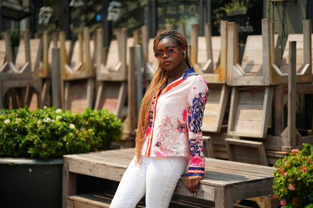 Fashionable Woman with Afro Curly Hairstyle at Streetの写真素材