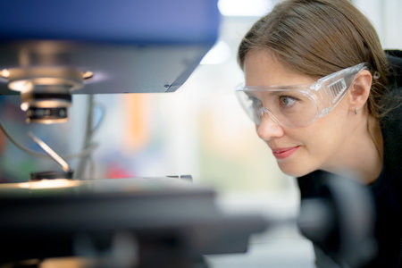 Multiracial industrial engineers working at automated AI robotic production factory - New technology conceptの写真素材