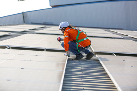 professional technician or engineer installing solar panels, Alternative energy for installed solar...