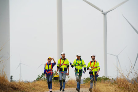 Engineer working at alternative renewable wind energy farm - Sustainable energy industry concept