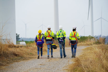 Engineer working at alternative renewable wind energy farm - Sustainable energy industry conceptの写真素材