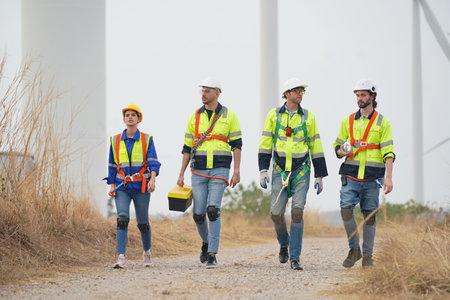 Engineer working at alternative renewable wind energy farm - Sustainable energy industry concept
