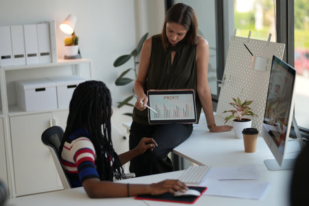 Business discussions. Shot of businesswomen brainstorming in an office. Two women working at the officeの写真素材